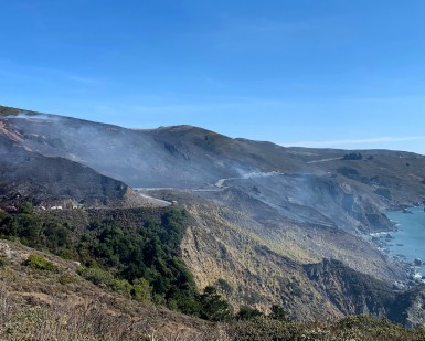 A view of a charred hillside after the Muir Fire.