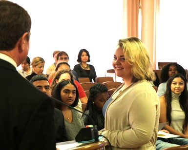 Kjersten Cox smiles as she listens to Marin County Supervisor Damon Connolly congratulate her on her participation with the Career Explorers program.
