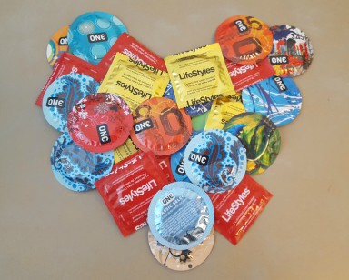 Condom packages arranged in the shape of a heart