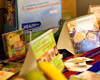 Pamphlets and booklets about healthy eating are displayed on a table.
