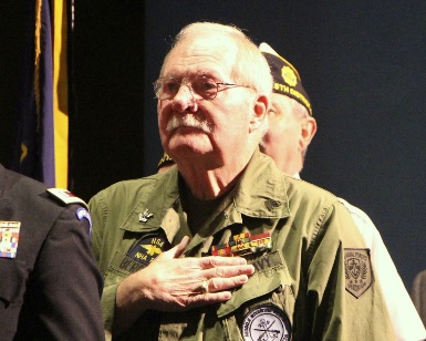 Ernie Bergman holds is hand over his heart during the national anthem during the 2014 Veterans Day ceremony at the Marin Civic Center.