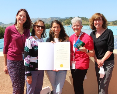 Five members of the Marin Medical Reserve Corps pose with their certificate of appreciation.
