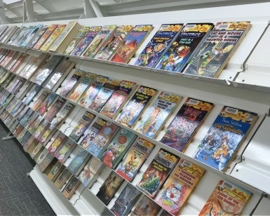 Books and magazines on a rack inside the Northgate mall library branch.