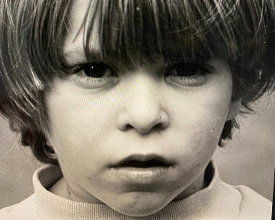 A headshot photo of Tony Goodman when he was a young boy in the 1970s.