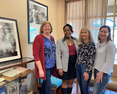 From left, Sara Jones, Chantel Walker, Laurie Thompson, Carol Acquaviva with the voting rights display at the library. 