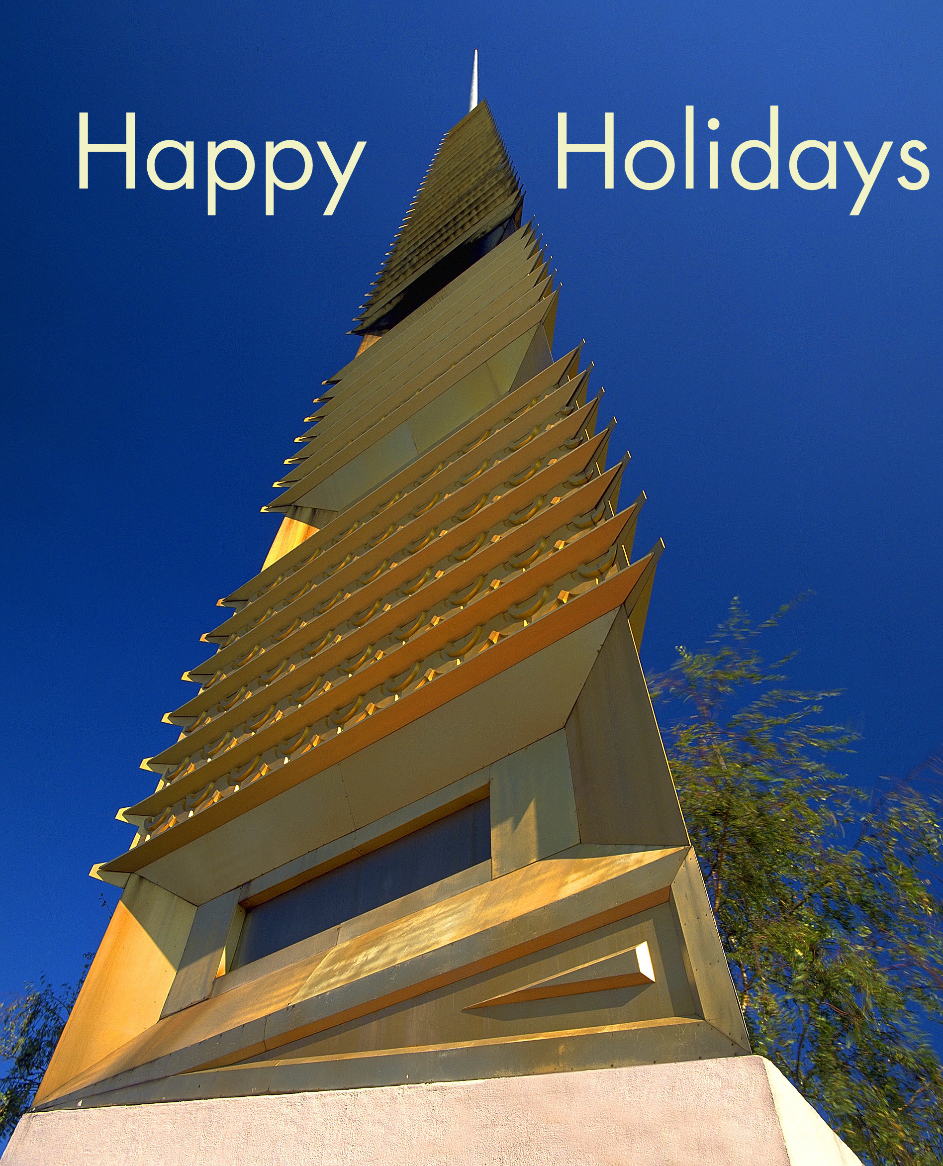 A image of the spire at the Civic Center with the words Happy Holidays.