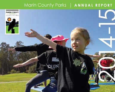 The cover of Parks' annual report shows kids doing stretching at a park.