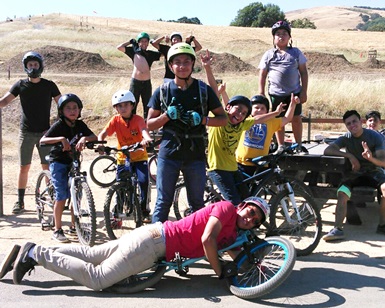 About a dozen boys with bikes pose for a photo at the Stafford Lake Bike Park near Novato