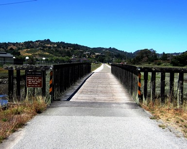 A view of an old wooden bridge that's part of the Mill Valley-Sausalito Multiuse Pathway.