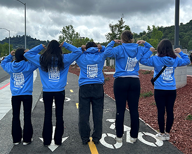 Youth Participants in Marin 9 to 25 program stand with their backs to camera, displaying the "find your way" logo