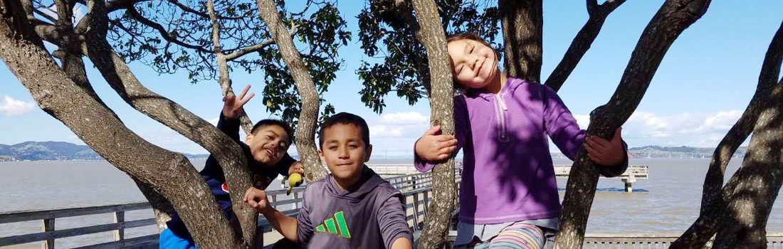 Latino children playing at McNears Beach