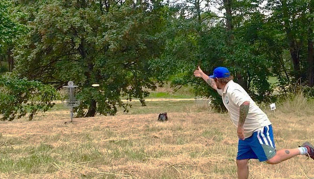 Man playing disc golf