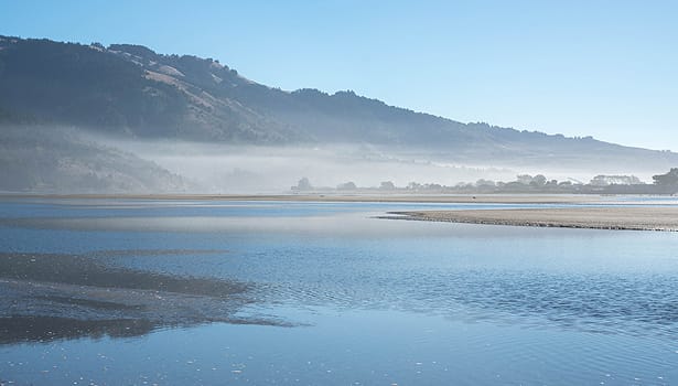 Morning mist over blue lagoon