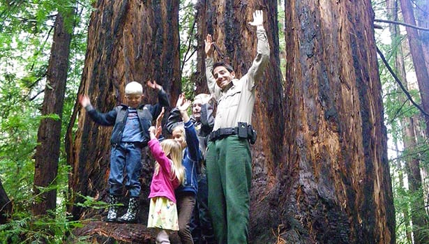 Ranger with kids in redwood grove
