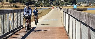 Cyclists riding over new pathway bridge deck