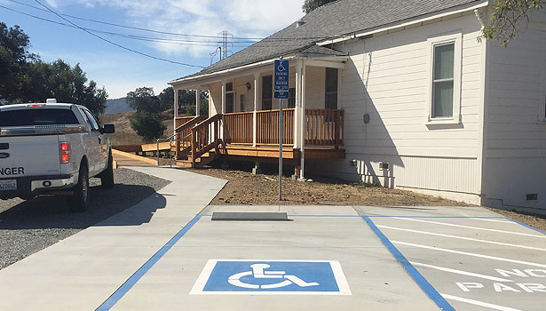Disability parking, wheelchair ramp, and new porch at Deer Island farmnouse