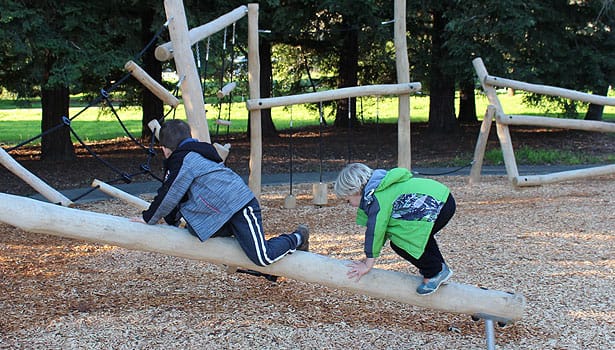 Two boys climbing at the playground