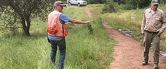 Parks staff and contractor inspecting fire road